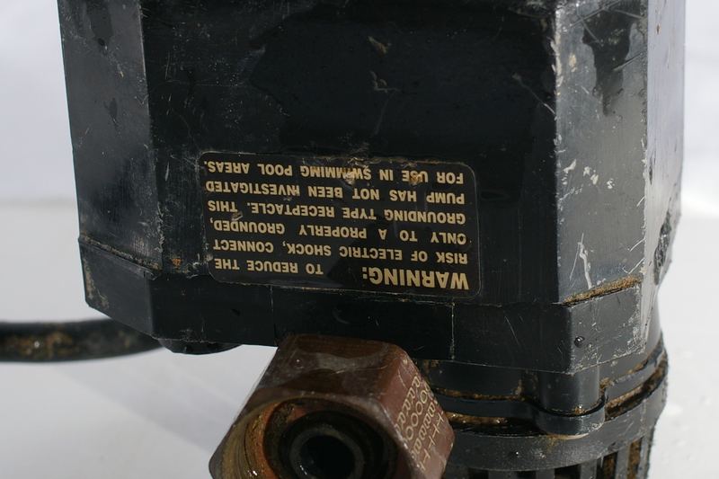 Small submersible sump pump with hose connection